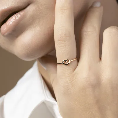 Yellow gold ring with heart sign