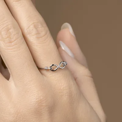 White gold ring with infinity sign
