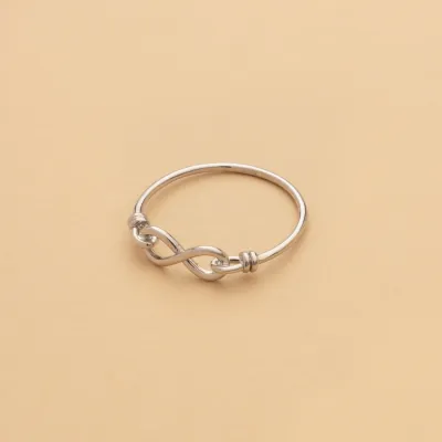 White gold ring with infinity sign