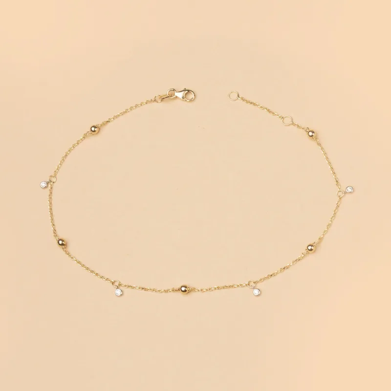 Yellow gold anklet with spheres and cubic zirconia