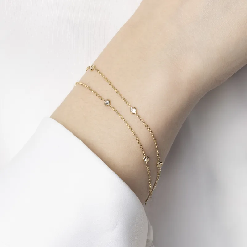 Dubbele armband in geel goud met zirkonia