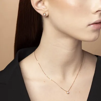 Rose gold solitare set with cubic zirconia: necklace and earrings