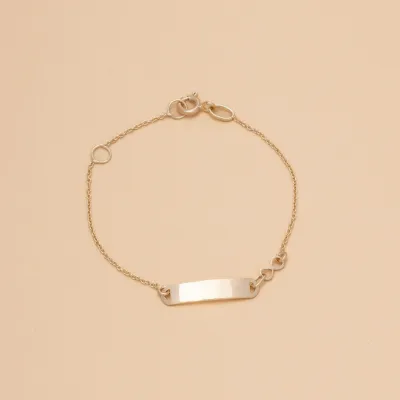 Yellow gold baby bracelet with infinity sign and plate