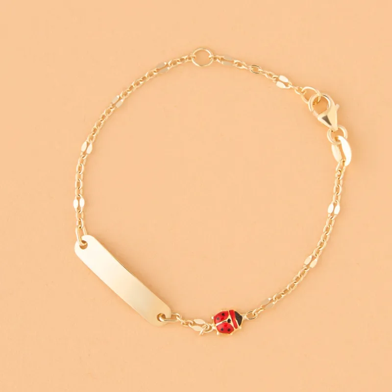 Yellow gold children's bracelet with enameled ladybugs