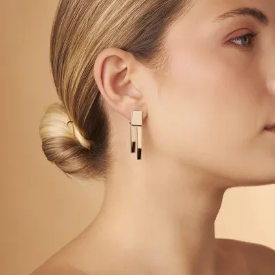 Yellow gold earrings  with black enameled details from "Futura" collection