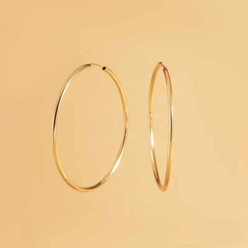 Yellow gold tube earrings 40 mm