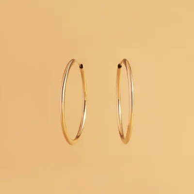 Yellow gold tube earrings 25 mm