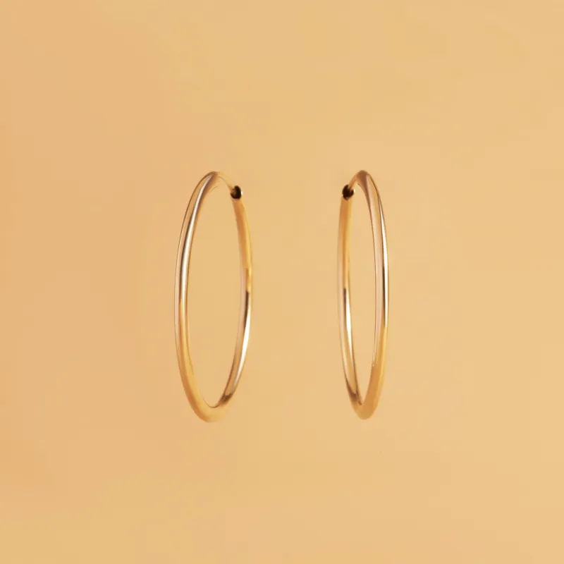 Yellow gold tube earrings 25 mm