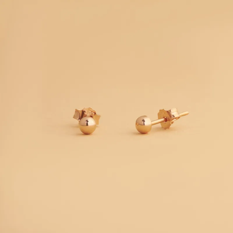 Rose gold stud earrings  in the shape of a sphere