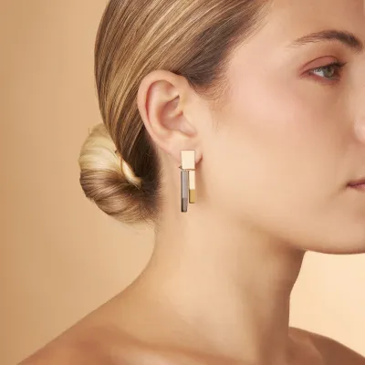 Yellow gold and black rhodium earrings from the "Futura" collection