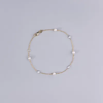 Yellow gold bracelet with pearls and cubic zirconia