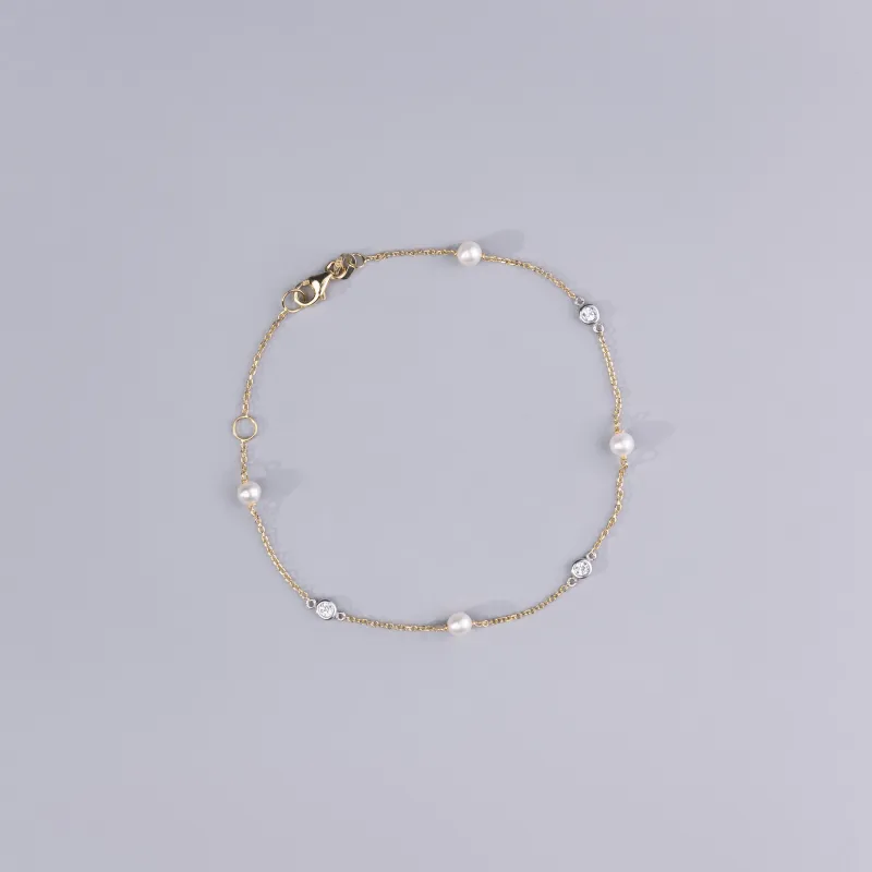 Bracciale in oro giallo con perle e cubic zirconia