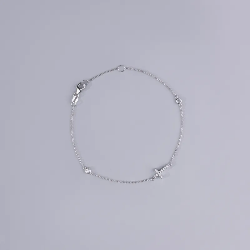 White gold bracelet with cross and cubic zirconia