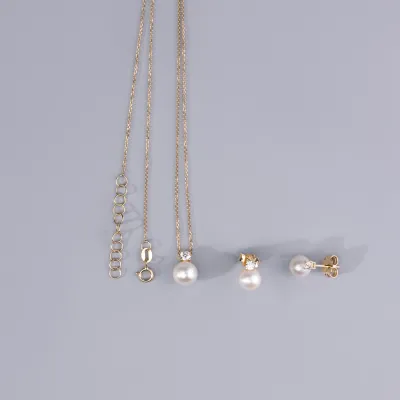 Geelgouden set (ketting + oorbellen) met zirkonia en parels