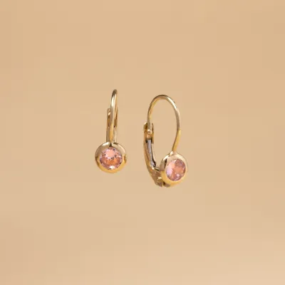 Baby earrings in yellow gold with pink cubic zirconia