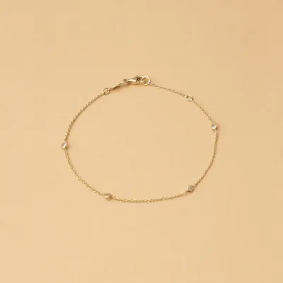 Yellow gold bracelet with white cubic zirconia